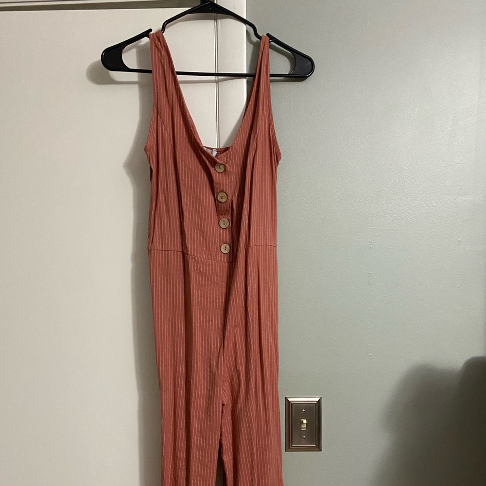 Pinstripe jumpsuit with buttons. Fitted